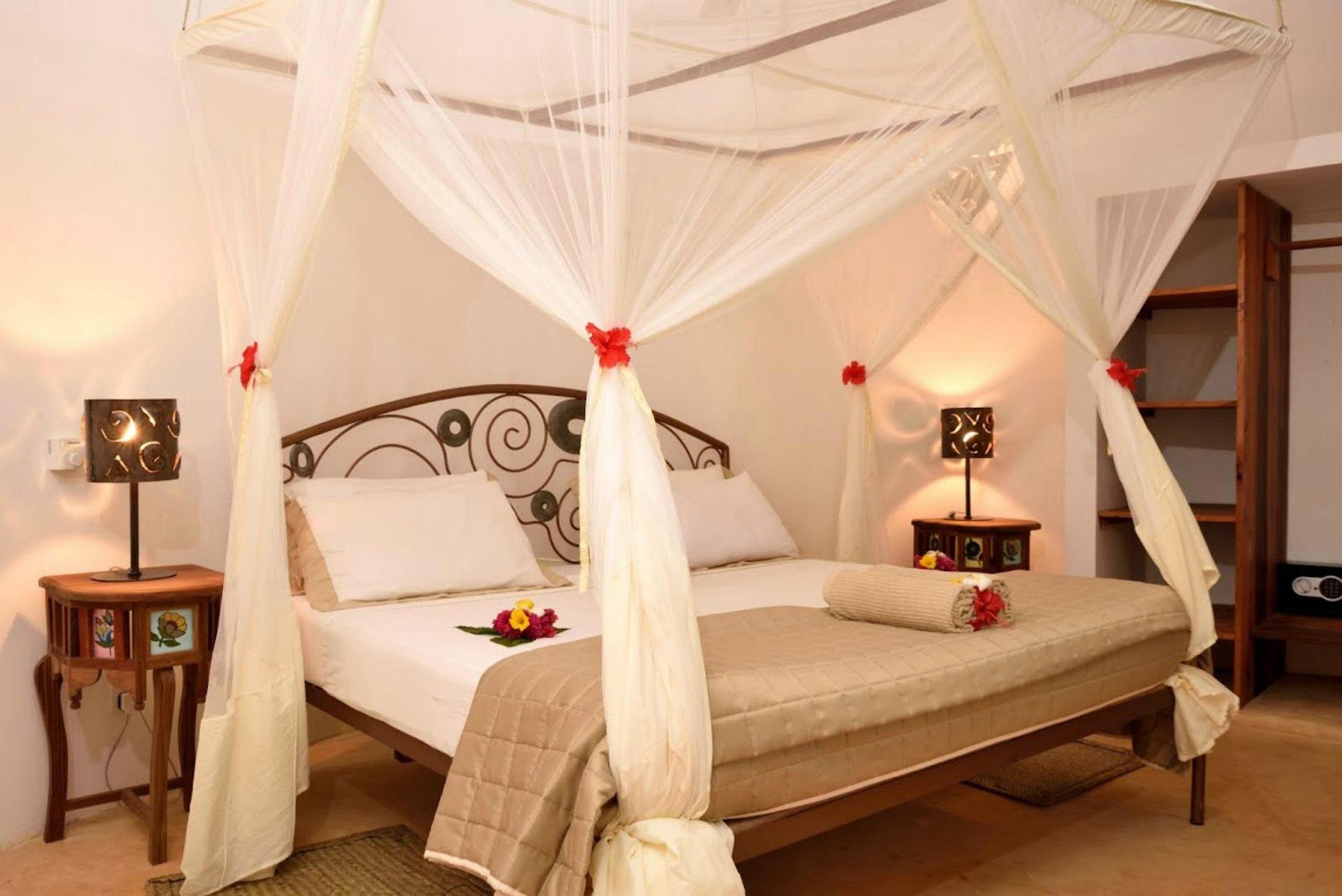 Interior of a room with a canopied bed