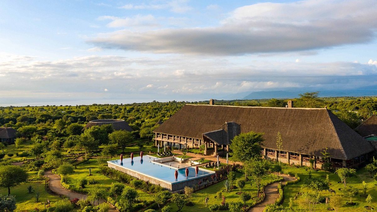 Aerial view of the building with pool and garden grounds