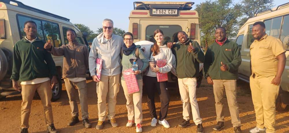 Family during a game drive at Safari & Zanzibar in the Tanzanian savannah